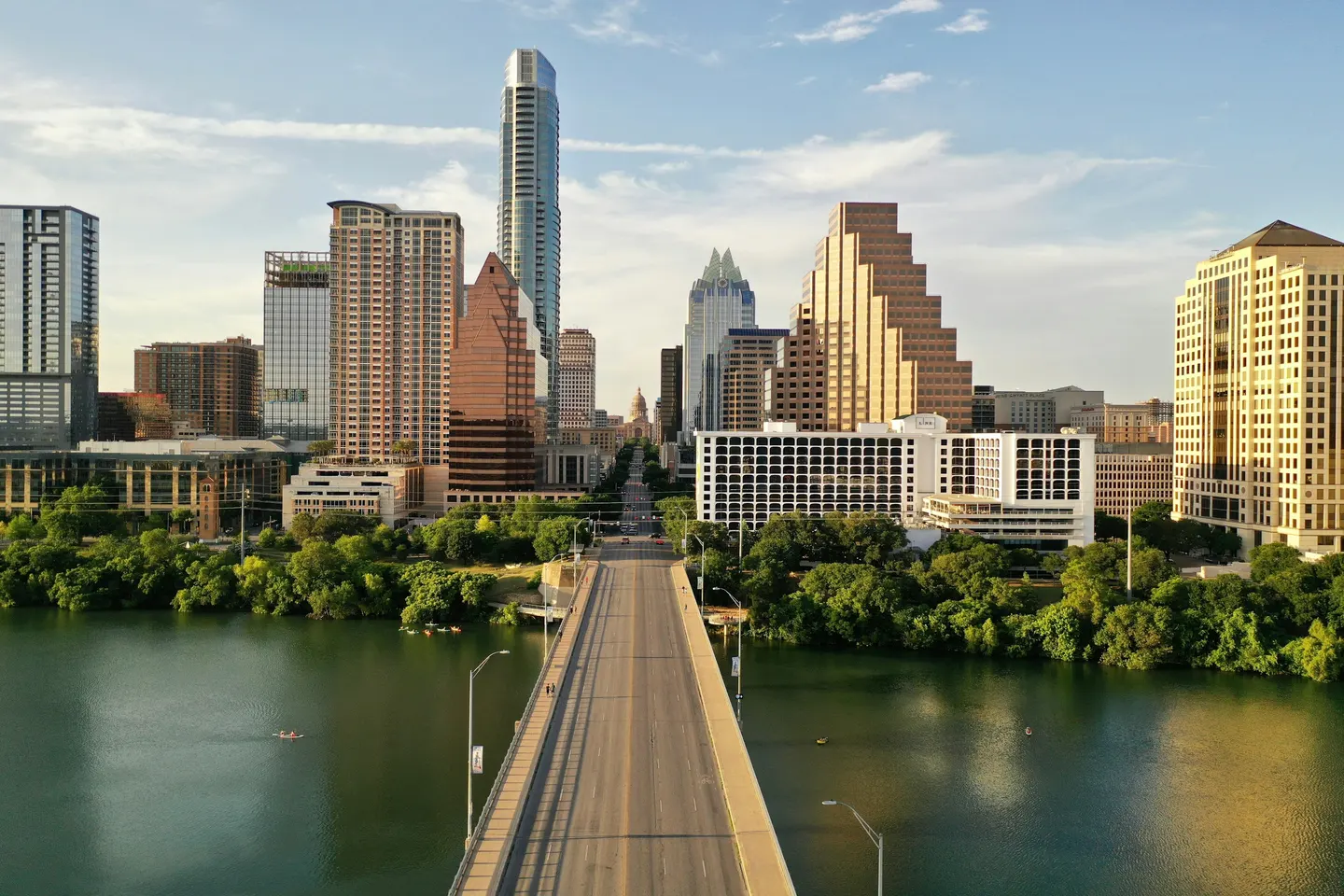 Austin skyline over Lady Bird Lake under a clear blue sky