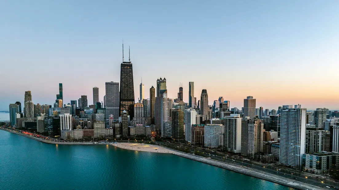 Chicago's lakefront skyline at dusk, seen from above Lake Michigan
