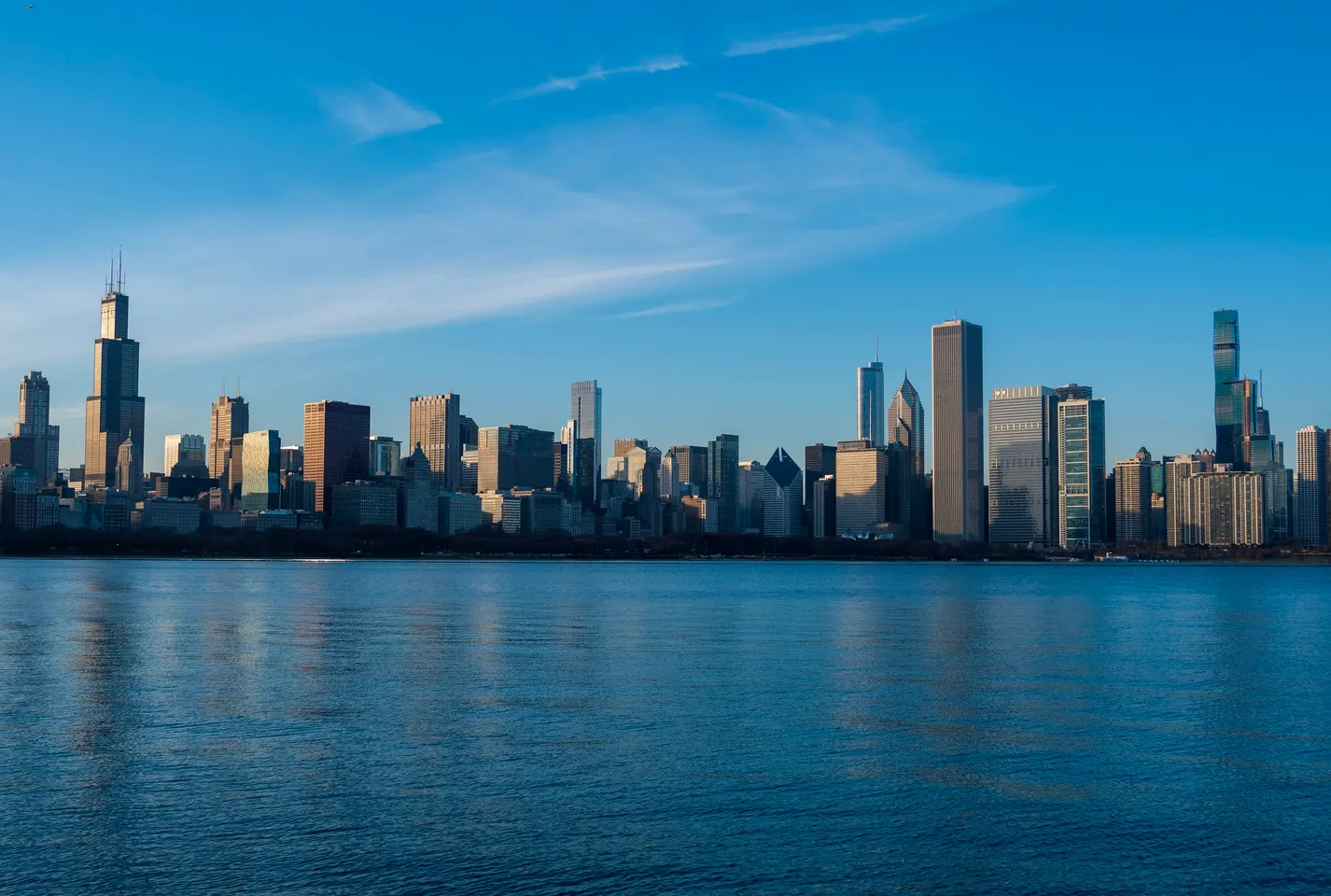 Chicago's lakefront skyline at dusk, seen from above Lake Michigan