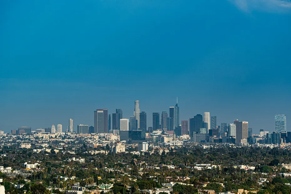 Downtown Los Angeles skyline under a clear blue sky