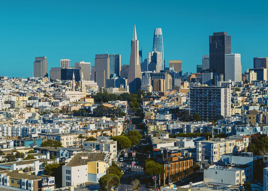 San Francisco skyline in daylight, seen from a hilltop across the city