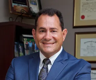 Dr. Mark E. Vasiliadis